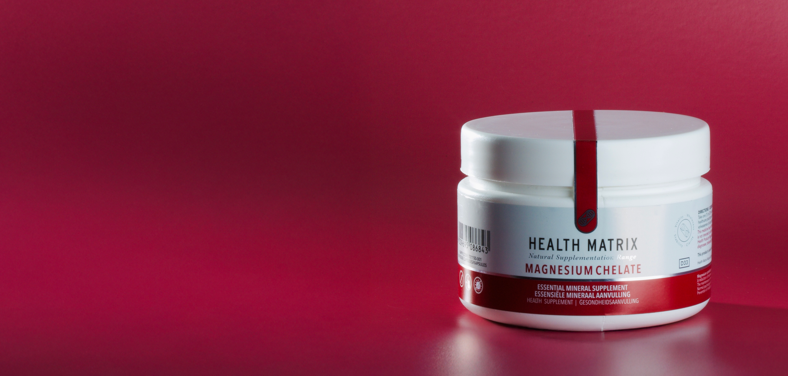 Health Matrix Magnesium Chelate supplement against a burgundy background